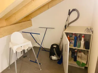 a room with a desk and a chair in a attic at Ferienwohnung mit Sauna in Wildhaus in Wildhaus