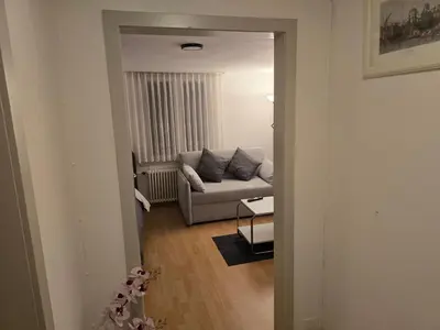 a living room with a couch and a table at Central studio apartment stgallen gratis Parkplatz in St. Gallen