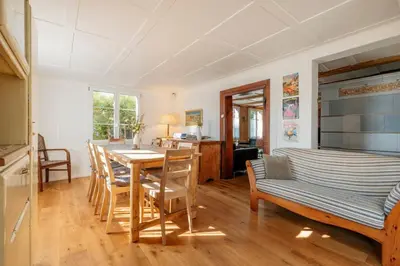 a kitchen and dining room with a table and chairs at Das aussergewöhnliche Gäste- und Ferienhaus in Güttingen