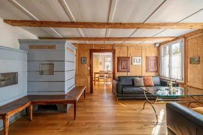 a living room with a couch and a table at Das aussergewöhnliche Gäste- und Ferienhaus in Güttingen