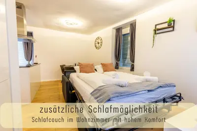 a bedroom with a bed in a room at Jasminkas Host 3 - Stadtwohnung mit Küche & gratis Parkplatz in St. Gallen