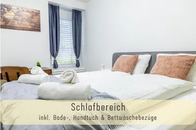a bedroom with two beds with towels on them at Jasminkas Host 3 - Stadtwohnung mit Küche & gratis Parkplatz in St. Gallen