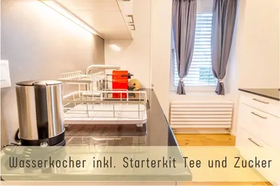 a hospital room with ice unit istg istg istg at Jasminkas Host 3 - Stadtwohnung mit Küche & gratis Parkplatz in St. Gallen