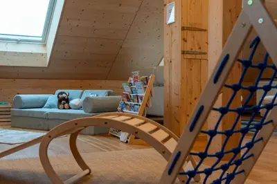 a room with a couch and a dog laying on a couch at Ganzes Haus am Bodensee in den Bergen im Appenzell in Heiden