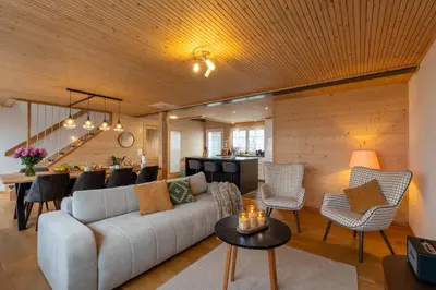 a living room with a couch and a table at Ganzes Haus am Bodensee in den Bergen im Appenzell in Heiden