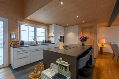 a kitchen with a large island in a room at Ganzes Haus am Bodensee in den Bergen im Appenzell in Heiden