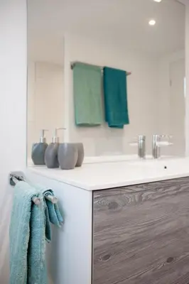 a bathroom with a sink and a counter with towels at Apartment Ferien im Toggenburg by Interhome in Krummenau