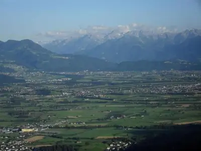 an aerial view of a green field with mountains at Apartment Rheintalblick by Interhome in Oberegg