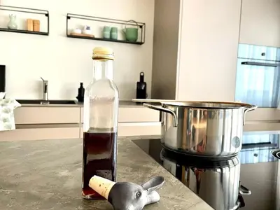 a bottle of sauce sitting on top of a kitchen counter at Apartment im Dorf Urnäsch by Interhome in Urnäsch