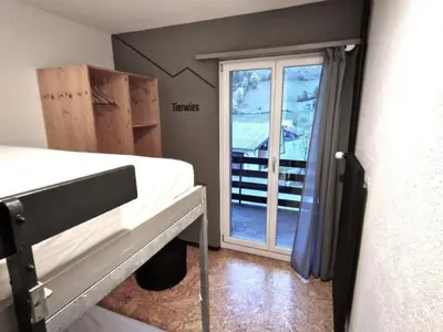 a small room with a bed and a window at Holiday Home Ski- und Gruppenhaus by Interhome in Alt Sankt Johann