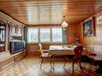 a dining room with a table and a tv at Apartment Hautle by Interhome in Appenzell Innerrhoden