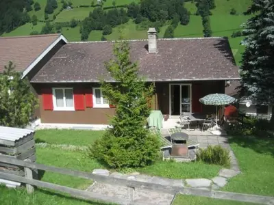 a house with a yard with a table and chairs at Apartment Bijou by Interhome in Alt Sankt Johann