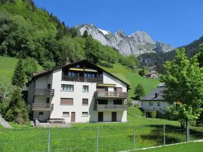 a large white building in the middle of a mountain at Apartment Weiherhof by Interhome in Wildhaus