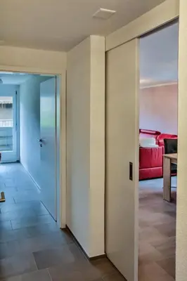 a hallway with a door leading to a bedroom at Apartment Weiherhof by Interhome in Wildhaus