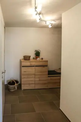 a room with a wooden cabinet and a floor at Apartment Weiherhof by Interhome in Wildhaus