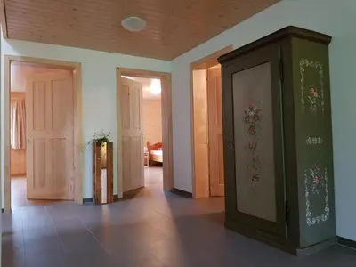 an empty room with doors and a room with at Apartment Ferien im Gugger - Wohnung Stockberg by Interhome in Nesslau