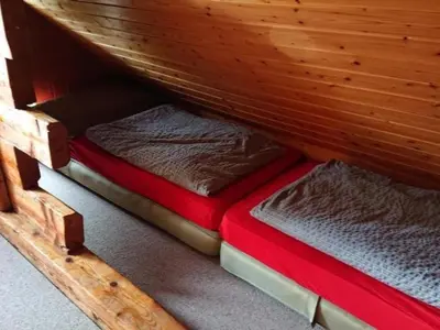 two bunk beds in a wooden room at Holiday Home Ferien in der Vogelherd by Interhome in Wolfhalden