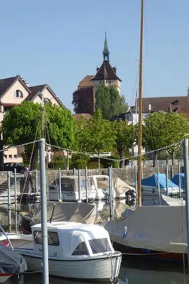 a white boat is docked at a marina at Holiday Home Gartenbungalow 2 - 3 Personen by Interhome in Arbon