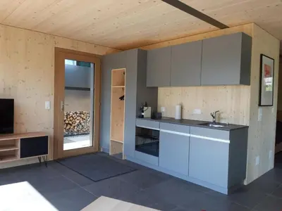 a kitchen with a sink and a counter top at Holiday Home Gartenbungalow 2 - 3 Personen by Interhome in Arbon