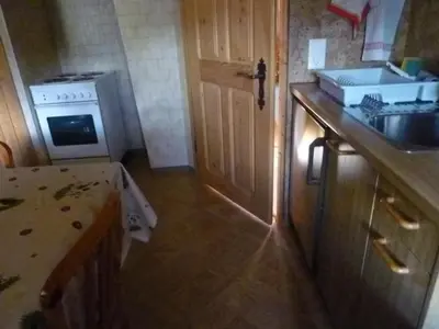 a small kitchen with a sink and a stove at Apartment Bauernhof ufem Berg by Interhome in Herisau