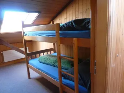two bunk beds in a cabin with a window at Apartment Bauernhof ufem Berg by Interhome in Herisau