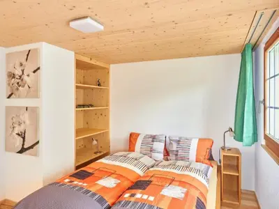 a bedroom with a bed in a room at Apartment Hof Höchi by Interhome in Bruggen