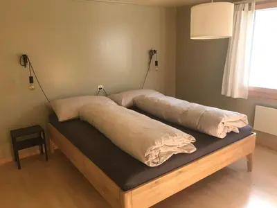 a bed with two pillows on top of it at Holiday Home Soldanella by Interhome in Appenzell