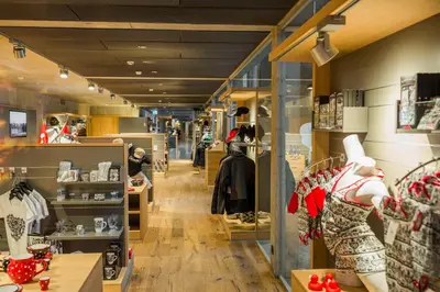 a store hallway with a lot of clothes on display at Säntis - das Hotel in Schwagalp