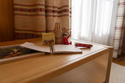 a desk with a book and a toy on it at Sonnegge in Wildhaus
