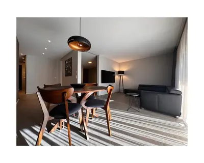 a dining room with a table and chairs at Zuhause am Bodensee in Bottighofen