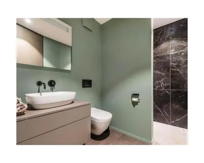 a bathroom with a sink and a toilet at Zuhause am Bodensee in Bottighofen
