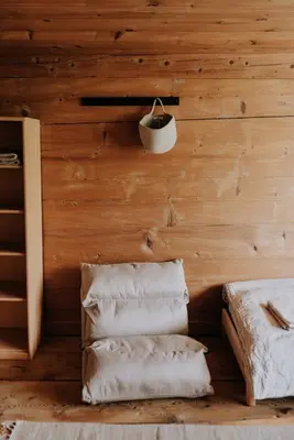 a room with a wooden wall with towels at Quiet exclusive house for 6 people in Brülisau