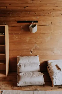 a room with a wooden wall with towels at Zimmer Alpstein im Appenzeller Ferienhaus in Brülisau