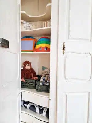 a closet with a stuffed monkey sitting on a shelf at FEWOCASA Central Family Apartment Rorschach - Lake Constance - 15 min OLMA in Rorschach