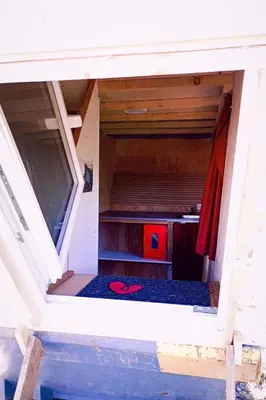 an inside view of a tiny house with the door open at Holiday Home Tiny Hause by Interhome in St. Gallen