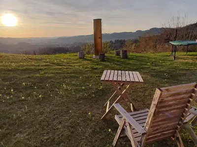 a picnic table and a chair sitting in a field at Apartment sunehus-ch by Interhome in Stein