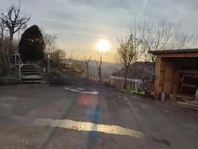 a road with the sun setting in the background at Apartment sunehus-ch by Interhome in Stein