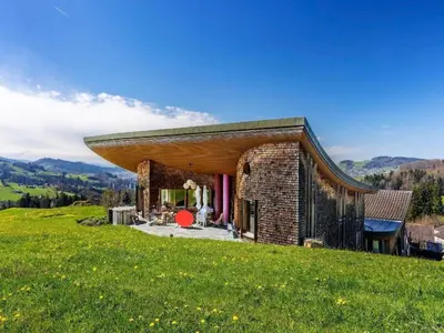 a brick house on top of a grassy hill at Apartment sunehus-ch by Interhome in Stein