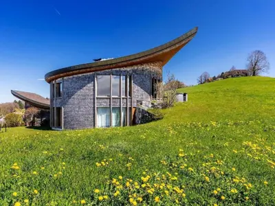 a house on a hill with a grassy field at Apartment sunehus-ch by Interhome in Stein