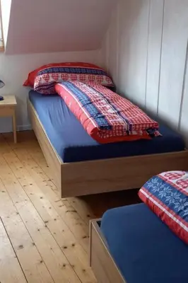 a bedroom with two twin beds in a room at Holiday Home Ferienhaus- - Stöckli Klingenbuch 20 by Interhome in Rehetobel