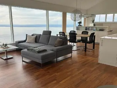 a living room with a couch and a table at Holiday Home Unterbilchen by Interhome in Eggersriet