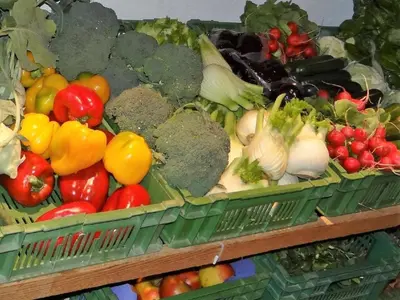 a display of fruits and vegetables in green baskets at Apartment Hof Bommes by Interhome in Gais