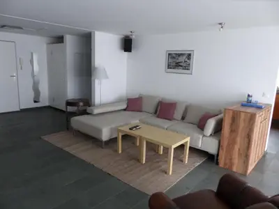 a living room with a couch and a coffee table at Apartment Moderne FeWo by Interhome in Appenzell