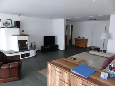 a living room with a couch and a tv at Apartment Moderne FeWo by Interhome in Appenzell