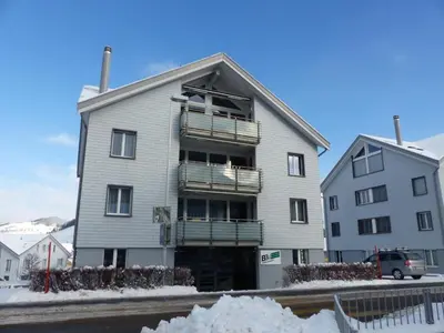 an apartment building with snow in front of it at Apartment Moderne FeWo by Interhome in Appenzell