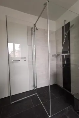 a shower with a glass door in a bathroom at Apartment HIRSCHEN by Interhome in Gossau
