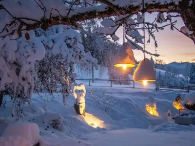 a fire hydrant covered in snow with lights at Apartment Vordere Au by Interhome in Schwellbrunn