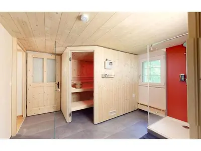a room with red walls and a glass door at Apartment Vordere Au by Interhome in Schwellbrunn