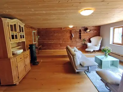 a living room with a couch and chairs and a table at Apartment Bauernhaus VordereAu by Interhome in Schwellbrunn