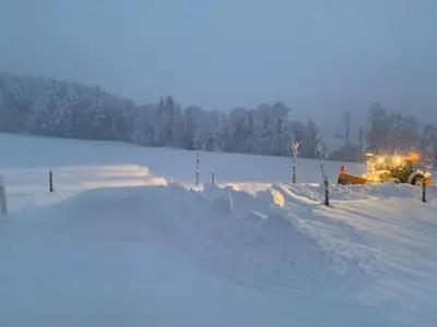 a bulldozer in a field covered in snow at Apartment nirkwerk by Interhome in Schönengrund